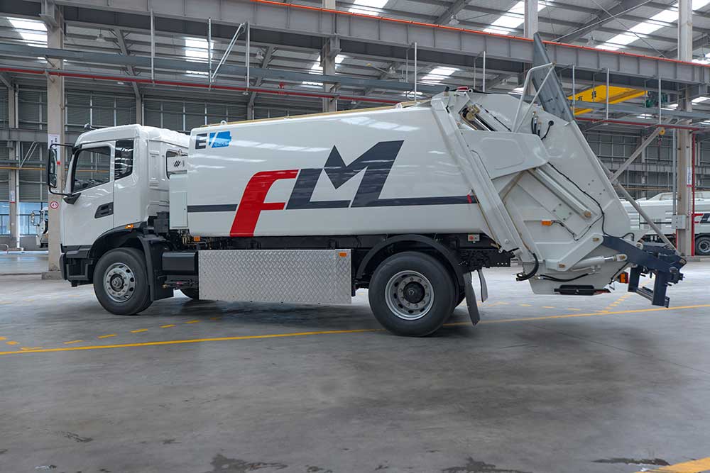 What is the difference between a side loader and a rear loader garbage truck?