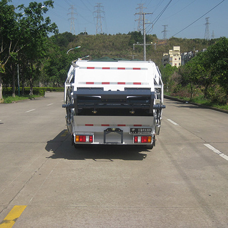 Explore the design and functionality of the rear end of a garbage truck